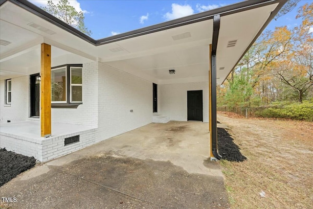 view of patio / terrace featuring a carport