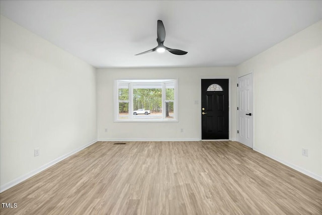 foyer entrance featuring light hardwood / wood-style floors and ceiling fan