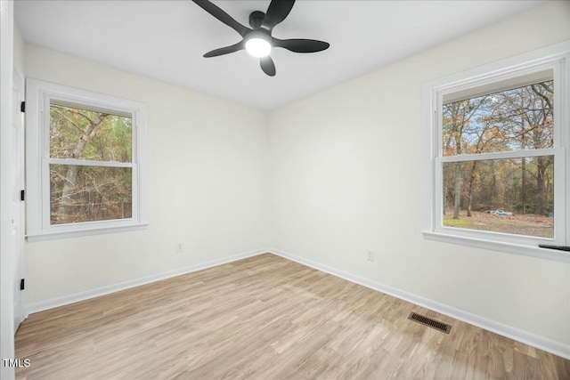 unfurnished room featuring ceiling fan and light hardwood / wood-style flooring