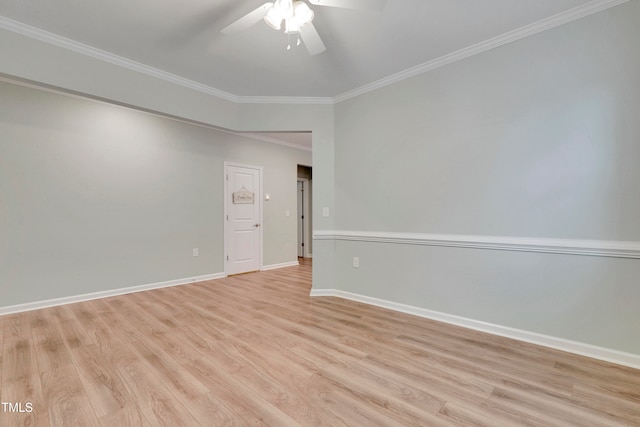 spare room with ceiling fan, light wood-type flooring, and ornamental molding