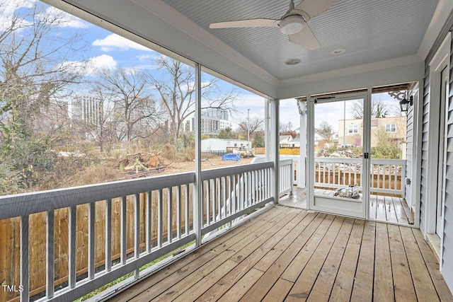 wooden deck featuring ceiling fan