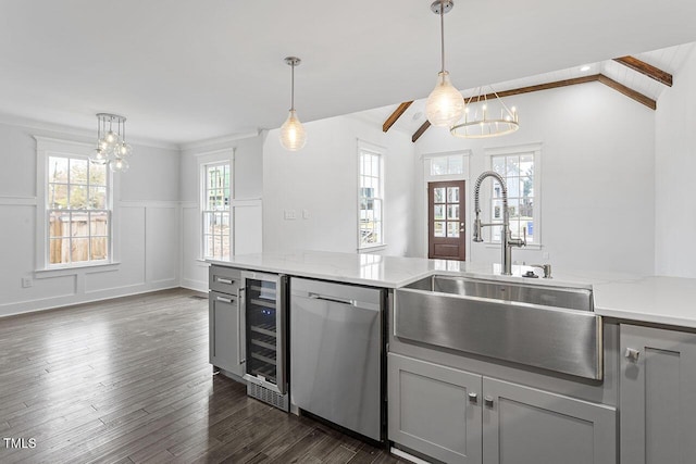 kitchen featuring wine cooler, dishwasher, sink, and gray cabinetry