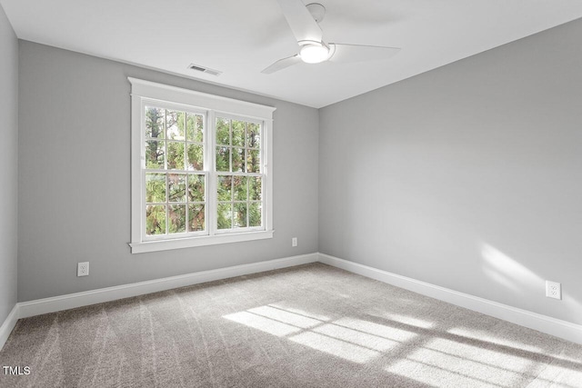 unfurnished room with carpet floors and ceiling fan