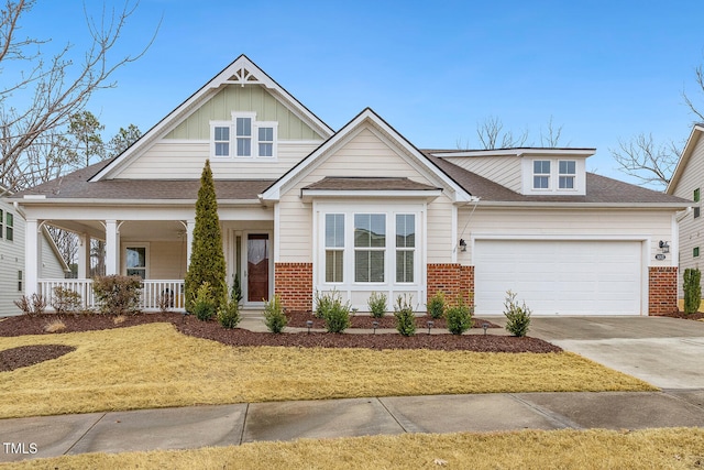 view of front of property with a garage and a porch