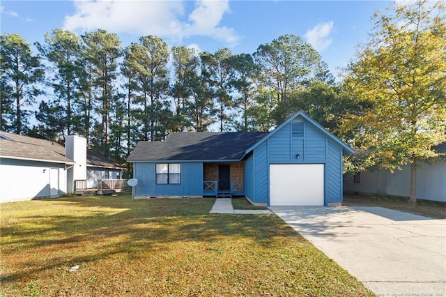 ranch-style home with a front lawn and a garage