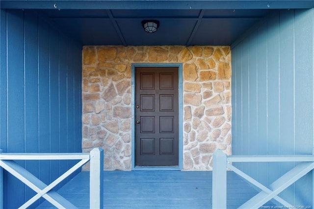 view of exterior entry with stone siding