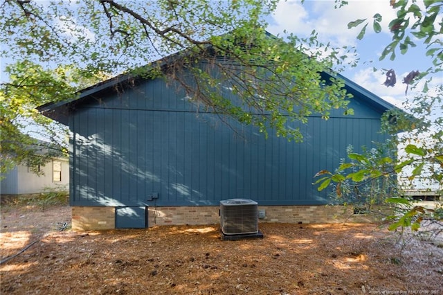 view of side of home featuring cooling unit