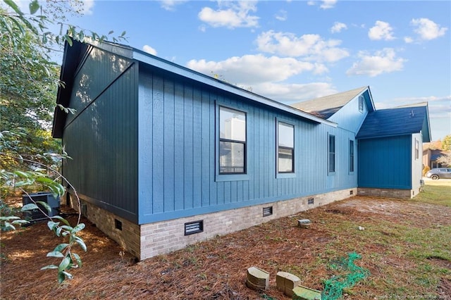 view of home's exterior with crawl space