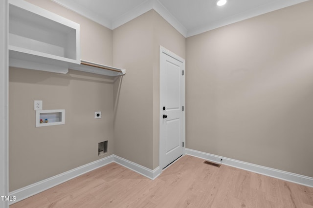 laundry area with washer hookup, hardwood / wood-style floors, crown molding, and electric dryer hookup