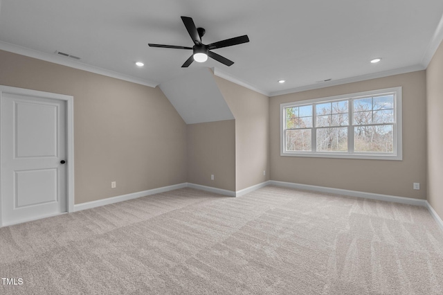 additional living space with light carpet and ceiling fan