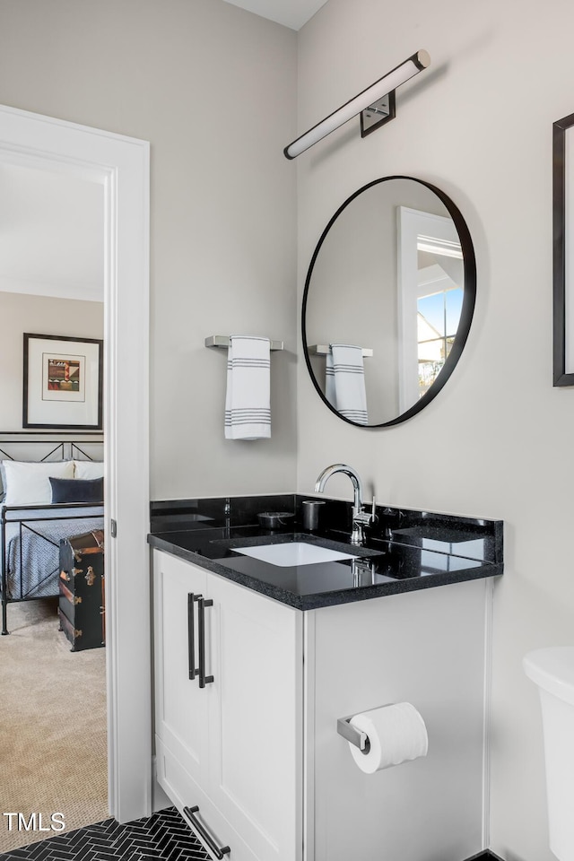 bathroom with vanity and toilet