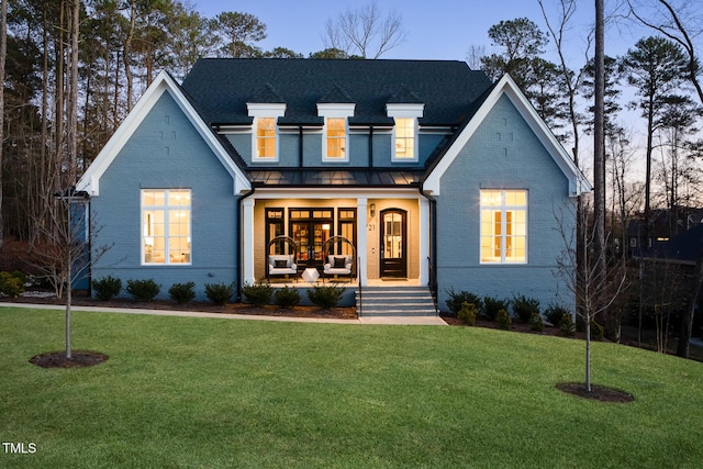 view of front facade featuring a porch and a front yard