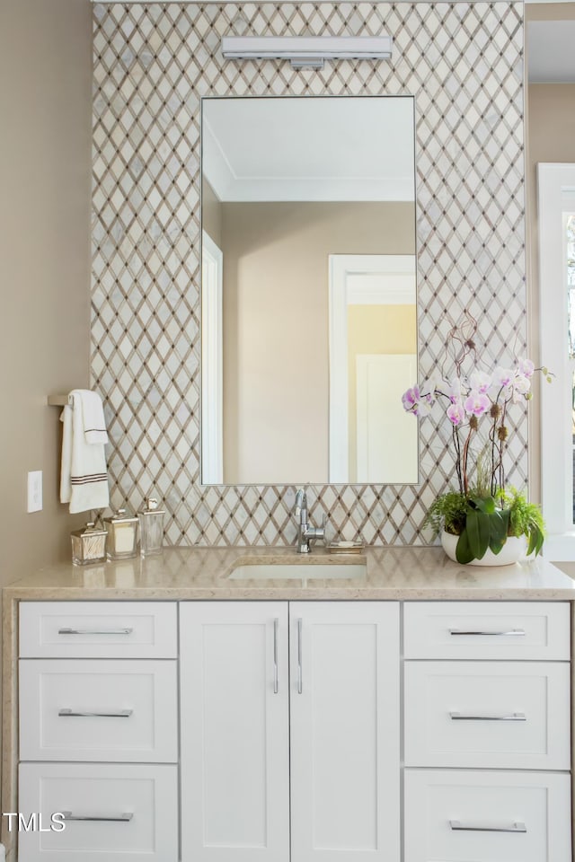 bathroom with vanity and decorative backsplash