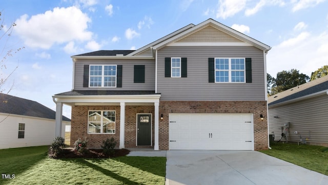 view of front of home featuring a garage and a front yard