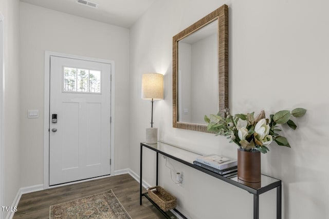 entrance foyer featuring dark hardwood / wood-style flooring