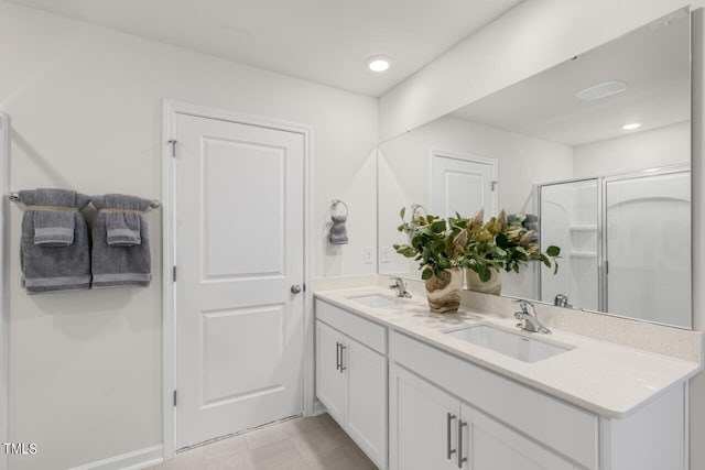 bathroom with vanity and walk in shower