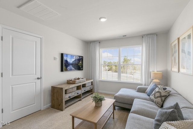 living room featuring light carpet