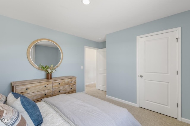 bedroom with light colored carpet