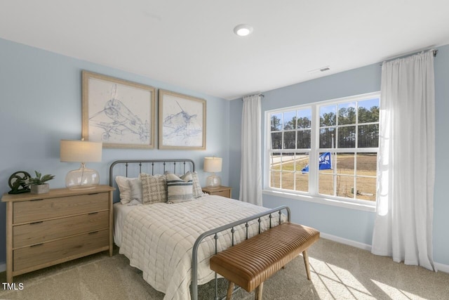 bedroom with light colored carpet