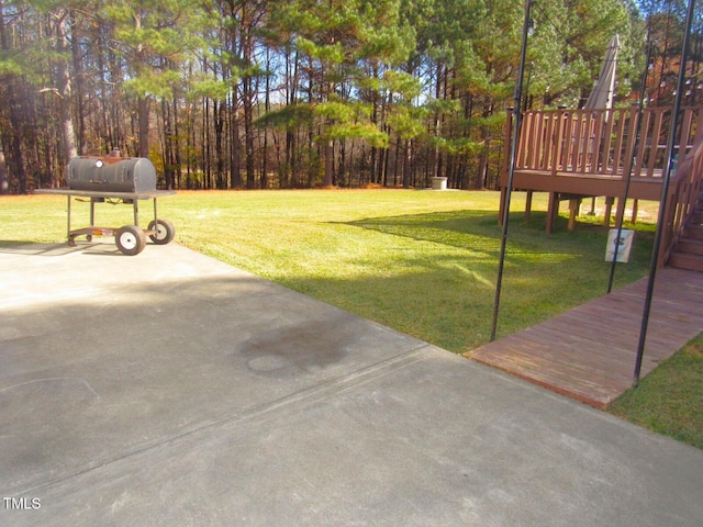 view of yard with a wooden deck