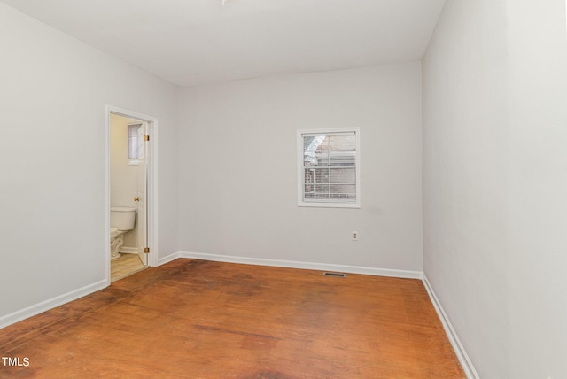 empty room with wood-type flooring