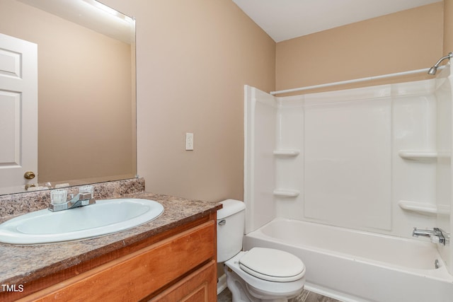 full bathroom featuring vanity, toilet, and shower / washtub combination