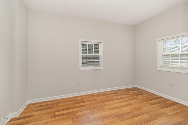 spare room with light hardwood / wood-style floors