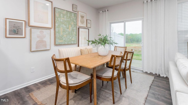 dining area featuring dark hardwood / wood-style flooring