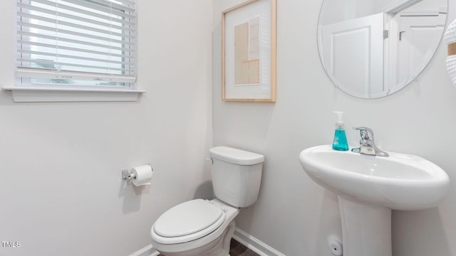 bathroom with toilet and sink