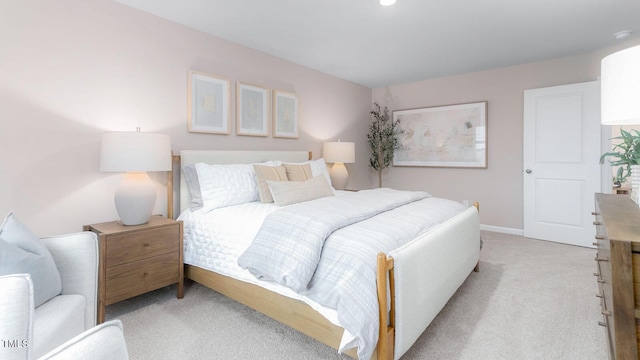 bedroom with light colored carpet