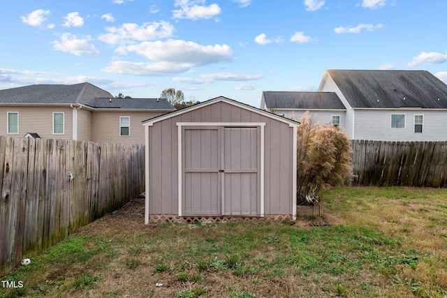 view of outbuilding with a yard