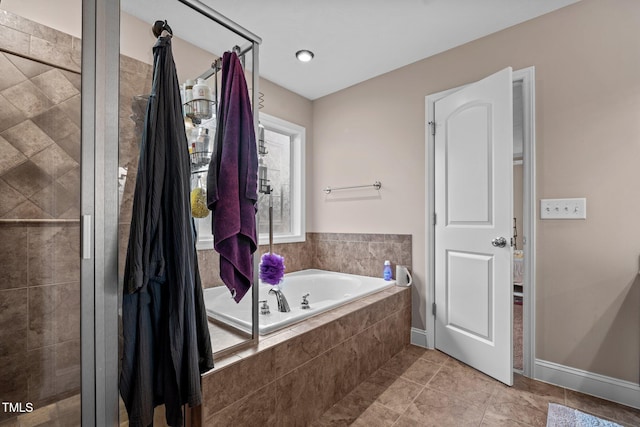 bathroom featuring plus walk in shower and tile patterned floors