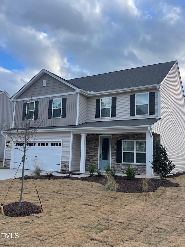 view of front of house featuring a garage and a front yard