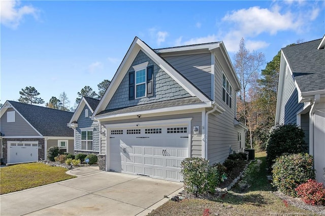 view of front of property with a garage and a front lawn