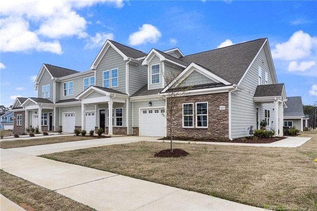 view of front facade featuring a garage and a front lawn