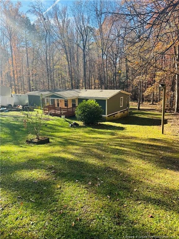 view of yard with a wooden deck