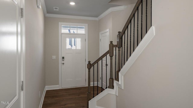 1825 Hinesley Dr, Durham, NC 27703 - foyer with dark wood-type flooring, stairway, ornamental molding, and baseboards