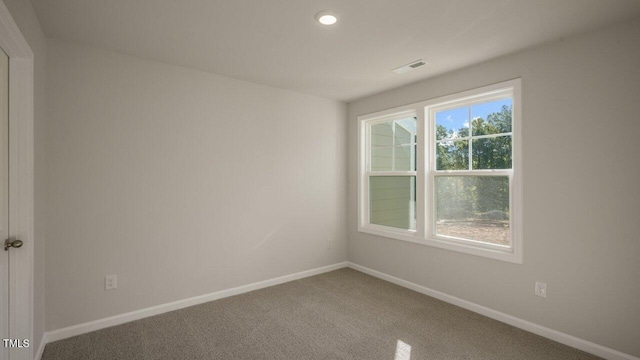 1825 Hinesley Dr, Durham, NC 27703 - carpeted spare room featuring baseboards and recessed lighting
