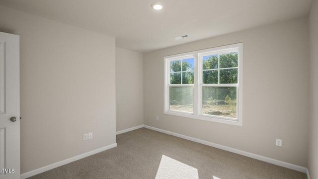 1825 Hinesley Dr, Durham, NC 27703 - carpeted empty room featuring baseboards and recessed lighting