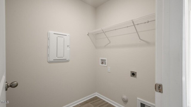 1825 Hinesley Dr, Durham, NC 27703 - laundry area with washer hookup, hookup for an electric dryer, baseboards, dark wood-type flooring, and hookup for a gas dryer