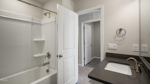 1825 Hinesley Dr, Durham, NC 27703 - bathroom featuring vanity, tub / shower combination, and baseboards