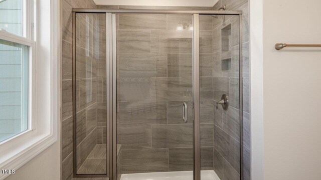 1825 Hinesley Dr, Durham, NC 27703 - bathroom featuring a stall shower