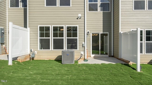 1825 Hinesley Dr, Durham, NC 27703 - rear view of house featuring central AC unit and a patio area