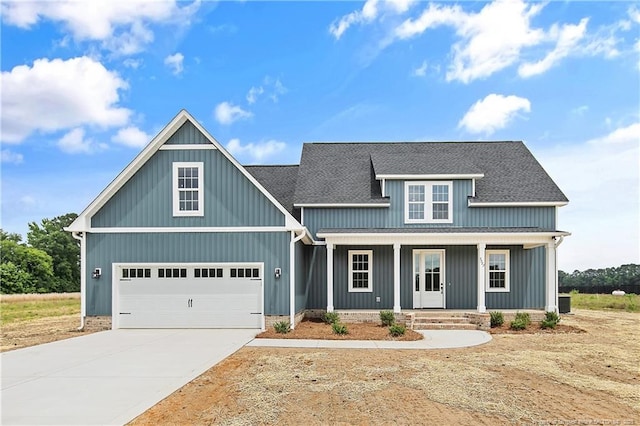 3727 Gainey Rd, Fayetteville, NC 28306 - view of front of home with driveway, a porch, a shingled roof, a garage, and board and batten siding