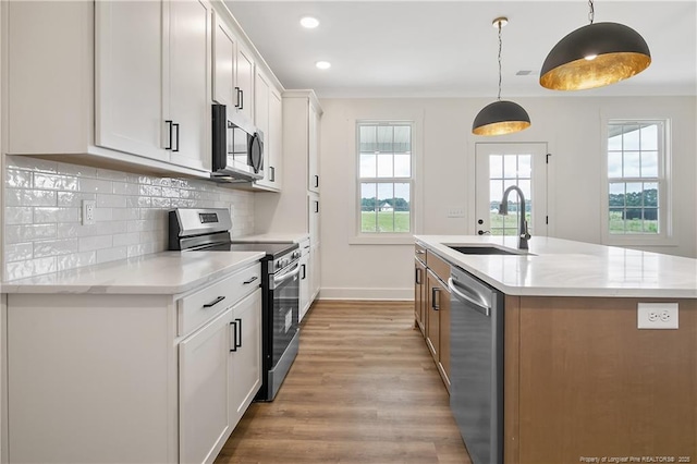 3727 Gainey Rd, Fayetteville, NC 28306 - kitchen with appliances with stainless steel finishes, a sink, light wood-style floors, healthy amount of natural light, and recessed lighting