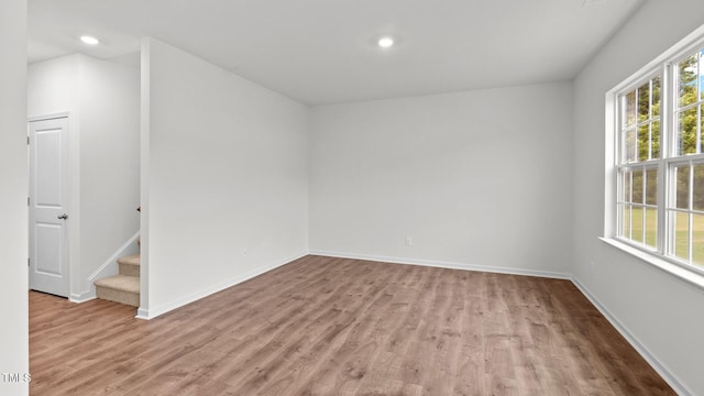 unfurnished room featuring light hardwood / wood-style flooring