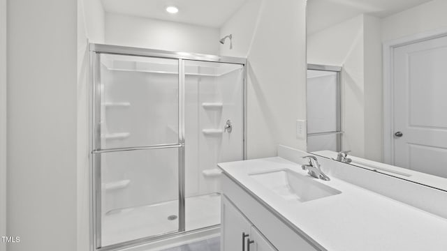 bathroom with vanity and an enclosed shower