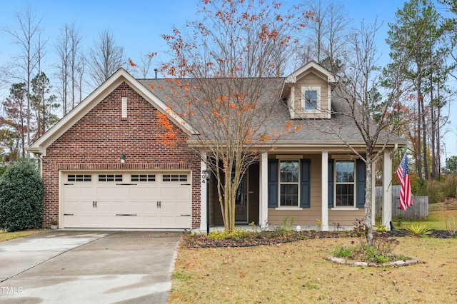 view of front of home featuring a garage and a front lawn