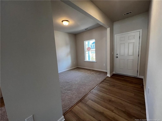 view of carpeted entrance foyer