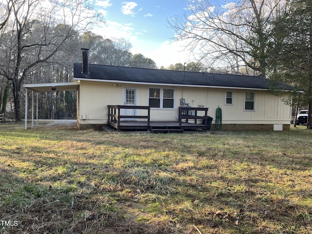 back of house with a yard and a deck